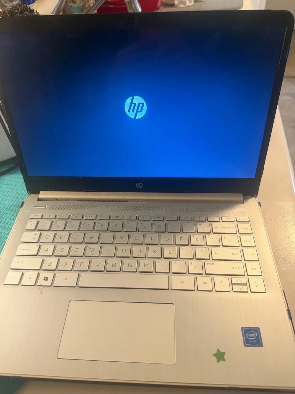 HP Silver Laptop with Blue Boot Screen